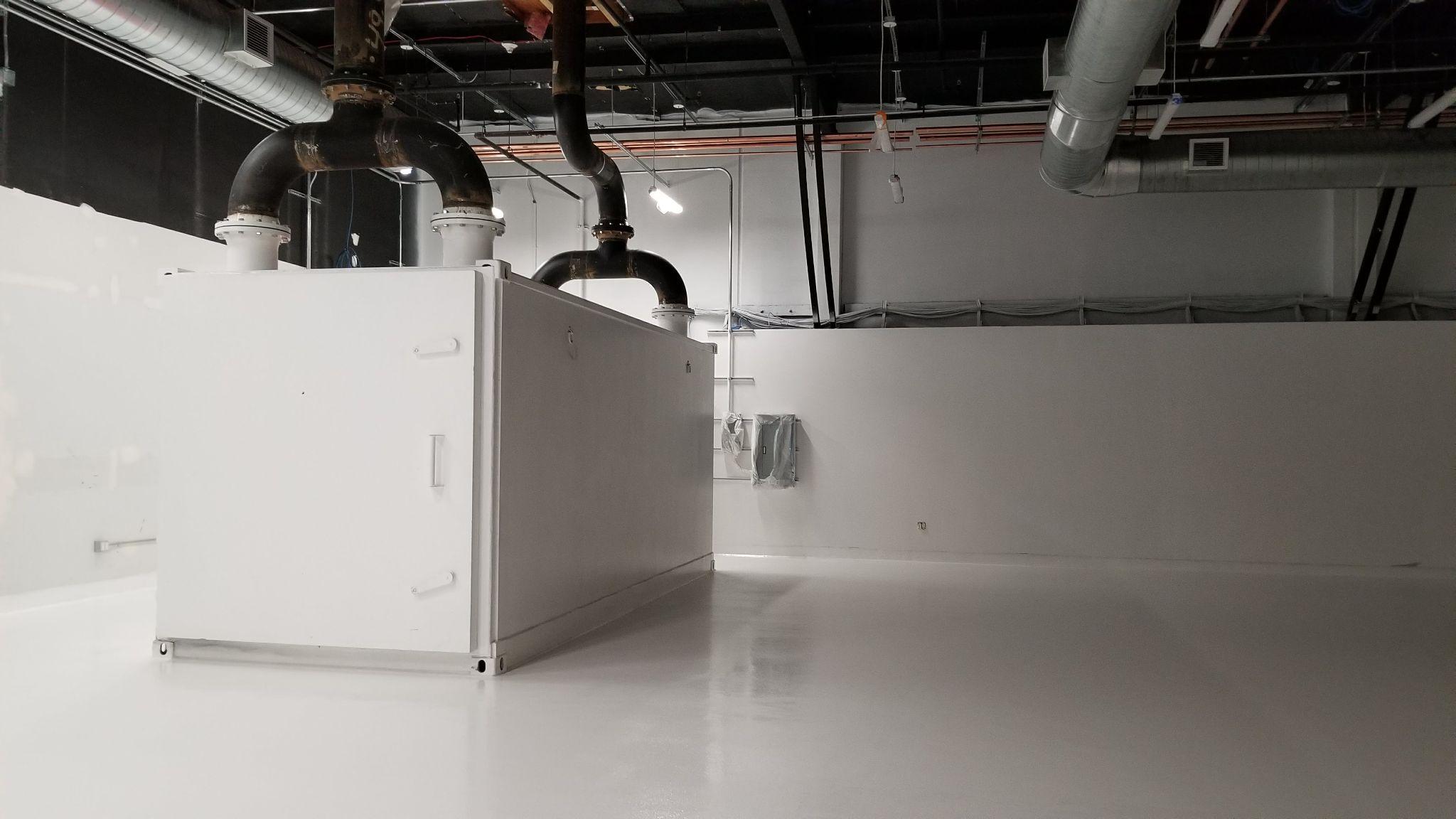 Experimental chambers and overhead services during the facility build-out.