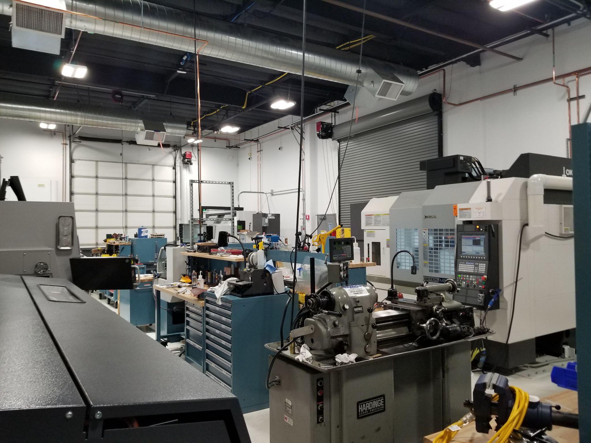 The manufacturing floor, with CNC and manual machine tools.